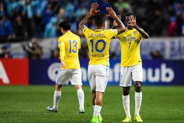 Alex Teixeira, left, and Ramires of China s Jiangsu Suning celebrate after scoring a goal against Japan s Gamba Osaka in their Group H match during the AFC Champions League 2017 in Osaka, Japan, 15 March 2017. Jiangsu Suning competes against Gamba Osaka at AFC group match  20170315_62579