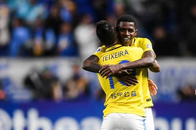 Alex Teixeira, left, and Ramires of China s Jiangsu Suning celebrate after scoring a goal against Japan s Gamba Osaka in their Group H match during the AFC Champions League 2017 in Osaka, Japan, 15 March 2017. Jiangsu Suning competes against Gamba Osaka at AFC group match  20170315_32273