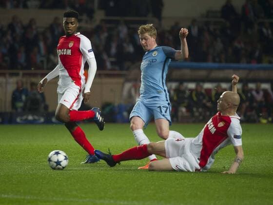 Football - UEFA Champions League - Round of Sixteen: AS Monaco 3 vs. Manchester City 5 Kevin De Bruyne of Manchester City tackled by Jemerson of Monaco, at the Stade Louis II. COLORSPORT WINSTON BYNORTH 