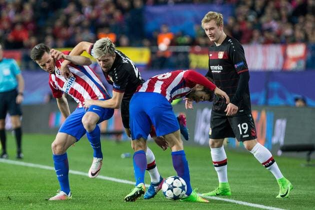 Kevin Kampl, Julian Brandt competes for the ball with Saul Iniguez and Vrsaljko of Atletico de Madrid during the match of Uefa Champions League between Atletico de Madrid and Bayer Leverkusen at Vicente Calderon Stadium in Madrid, Spain. March 15, 2017.  (20170315028)