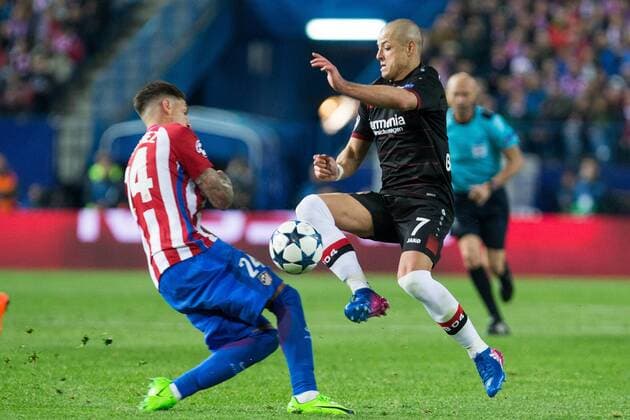 Jose Maria Gimenez of Atletico de Madrid competes for the ball with Javier Hernandez Chicharito of Bayer 04 Leverkusen during the match of Uefa Champions League between Atletico de Madrid and Bayer Leverkusen at Vicente Calderon Stadium in Madrid, Spain. March 15, 2017.  (20170315033)