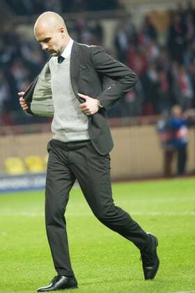 Football - UEFA Champions League - Round of Sixteen: AS Monaco 3 vs. Manchester City 5 Manchester City manager Pepe Guardiola looks down & looks to take off his jacket as he walks off after losing the game, at the Stade Louis II. COLORSPORT WINSTON BYNORTH 