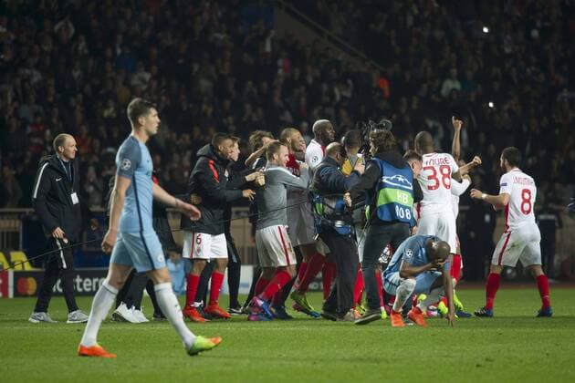 Football - UEFA Champions League - Round of Sixteen: AS Monaco 3 vs. Manchester City 5 monaco celebrate & manchester city look down after the final whistle at the Stade Louis II. COLORSPORT WINSTON BYNORTH 