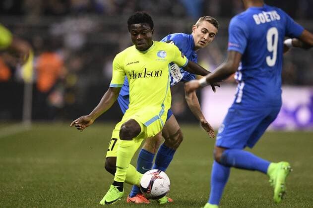 Gent s Moses Simon and Genk s Timothy Castagne fight for the ball during the return game of 1 8 finals of the Europa League competition between Belgian soccer team KRC Genk and Belgian club KAA Gent, Thursday 16 March 2017, in Genk. First leg in Gent ended on a 2-5 result. YORICKxJANSENS  x05065783x