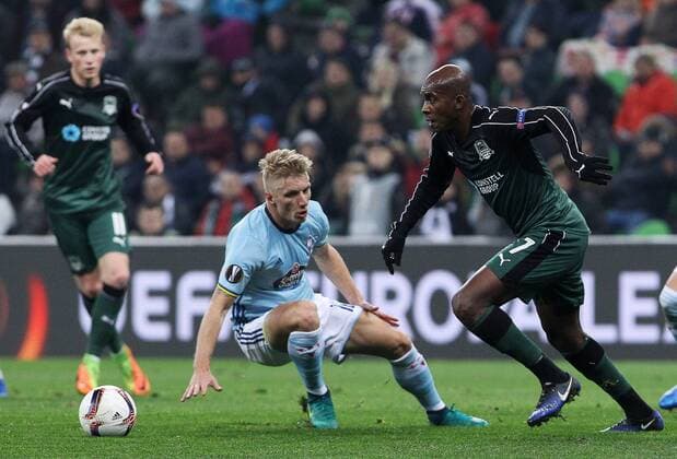 KRASNODAR, RUSSIA - MARCH 16, 2017: Celta de Vigoâ€™s Daniel Wass (L) and FC Krasnodarâ€™s Charles Kabore fight for the ball in their 2016-17 UEFA Europa League Round of 16 Leg 2 football match at Krasnodar Stadium. Vitaly Timkiv TASS  TS044869