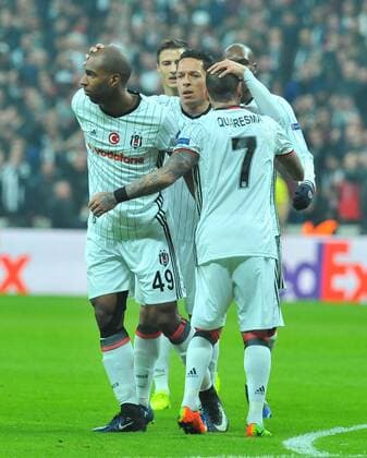 Besiktas players Ryan Babel and Vincent Aboubakar celebrates the victory during a Europa League round of 16 second leg soccer match at Vodafone Arena stadium in Istanbul, Thursday, March 16, 2017.(Tolga Adanali - Depo Photos)  15650181