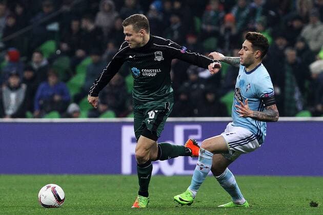 KRASNODAR, RUSSIA - MARCH 16, 2017: FC Krasnodarâ€™s Viktor Claesson (L) and Celta de Vigoâ€™s Hugo Mallo fight for the ball in their 2016-17 UEFA Europa League Round of 16 Leg 2 football match at Krasnodar Stadium. Celta de Vigo won the game 2-0. Vitaly Timkiv TASS  TS04488D