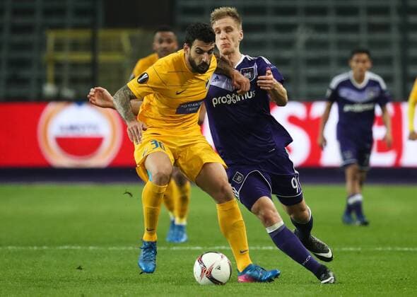 Apoel s Giorgos Merkis and Anderlecht s Lukasz Teodorczyk fight for the ball during a return 1 8 final game of the Europa League competition between Belgian soccer team RSC Anderlecht and Cyprus team Apoel Nicosie in Anderlecht, Thursday 16 March 2017. First leg in Nicosie ended on a 0-1 result. VIRGINIExLEFOUR  x05065979x