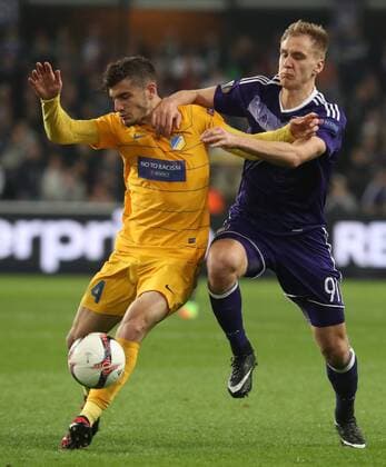 Apoel s Kostakis Artymatas and Anderlecht s Lukasz Teodorczyk fight for the ball during a return 1 8 final game of the Europa League competition between Belgian soccer team RSC Anderlecht and Cyprus team Apoel Nicosie in Anderlecht, Thursday 16 March 2017. First leg in Nicosie ended on a 0-1 result. VIRGINIExLEFOUR  x05065990x