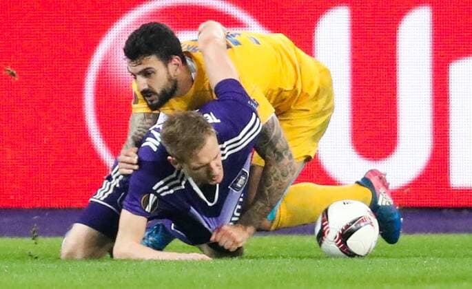 Apoel s Giorgos Merkis and Anderlecht s Lukasz Teodorczyk fight for the ball during a return 1 8 final game of the Europa League competition between Belgian soccer team RSC Anderlecht and Cyprus team Apoel Nicosie in Anderlecht, Thursday 16 March 2017. First leg in Nicosie ended on a 0-1 result. VIRGINIExLEFOUR  x05065999x