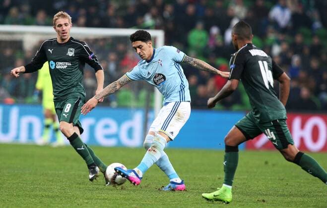 KRASNODAR, RUSSIA - MARCH 16, 2017: FC Krasnodarâ€™s Yury Gazinsky, Celta de Vigoâ€™s Pablo Hernandez, and FC Krasnodarâ€™s Wanderson (L) fight for the ball in their 2016-17 UEFA Europa League Round of 16 Leg 2 football match at Krasnodar Stadium. Celta de Vigo won the game 2-0. Vitaly Timkiv TASS  TS044898