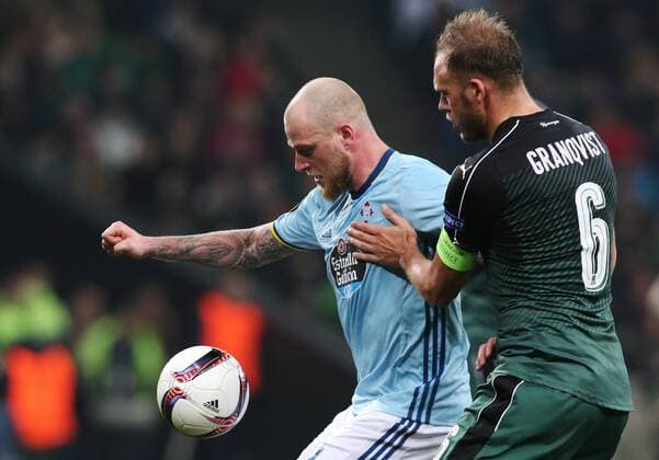 KRASNODAR, RUSSIA - MARCH 16, 2017: Celta de Vigoâ€™s John Guidetti (L) and FC Krasnodarâ€™s Andreas Granqvist fight for the ball in their 2016-17 UEFA Europa League Round of 16 Leg 2 football match at Krasnodar Stadium. Celta de Vigo won the game 2-0. Vitaly Timkiv TASS  TS04489B