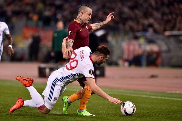 Radja Nainggolan of AS Roma is challenged by Lucas Tousart of Olympique Lyonnais during the UEFA Europa League match between Roma and Olympique Lyonnais at Stadio Olimpico, Rome, Italy on 16 March 2017. Copyright: xGiuseppexMaffiax 14640020
