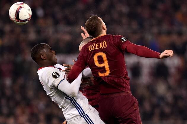 Edin Dzeko of AS Roma is challenged by Mouctar Diakhaby of Olympique Lyonnais during the UEFA Europa League match between Roma and Olympique Lyonnais at Stadio Olimpico, Rome, Italy on 16 March 2017. Copyright: xGiuseppexMaffiax 14640031
