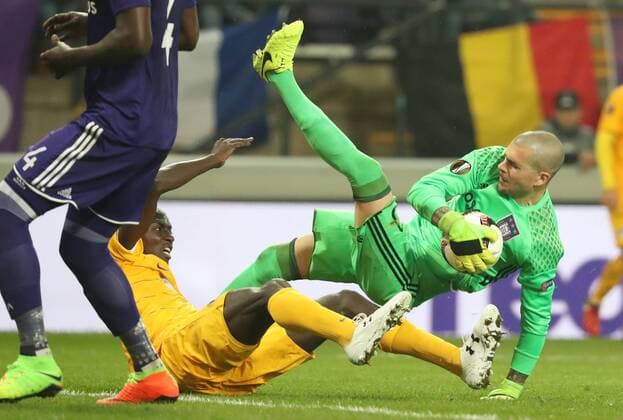 Apoel s Cedric Yambere and Anderlecht s goalkeeper Ruben Martinez fight for the ball during a return 1 8 final game of the Europa League competition between Belgian soccer team RSC Anderlecht and Cyprus team Apoel Nicosie in Anderlecht, Thursday 16 March 2017. First leg in Nicosie ended on a 0-1 result. VIRGINIExLEFOUR  x05066036x