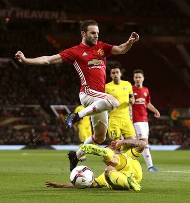 Juan Mata of Manchester United ManU hurdles a tackle during the UEFA Europa League Round of 16 2nd leg match at Old Trafford Stadium, Manchester. Picture date: March 16th, 2017. Pic credit should read: Matt McNulty Sportimage EDITORIAL USE ONLY. No use with unauthorised audio, video, data, fixture lists, club league logos or live services. Online in-match use limited to 120 images, no video emulation. No use in betting, games or single club league player publications.