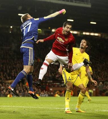 Nikita Medvedev of FC Rostov collides with Henrikh Mkhitaryan of Manchester United ManU during the UEFA Europa League Round of 16 2nd leg match at Old Trafford Stadium, Manchester. Picture date: March 16th, 2017. Pic credit should read: Matt McNulty Sportimage EDITORIAL USE ONLY. No use with unauthorised audio, video, data, fixture lists, club league logos or live services. Online in-match use limited to 120 images, no video emulation. No use in betting, games or single club league player publications.