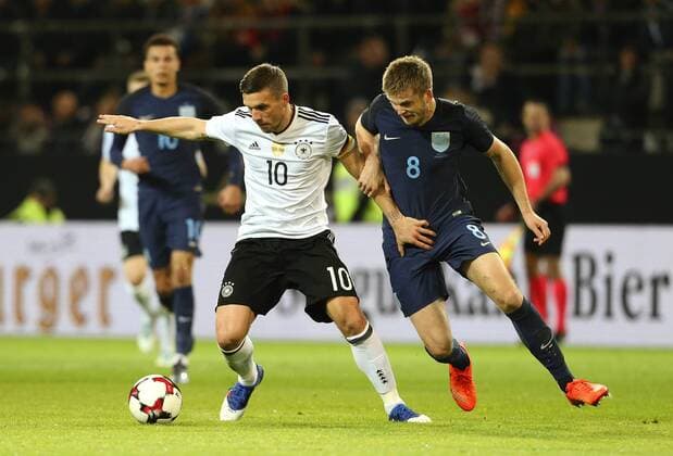 Lukas Podolski of Germany and Eric Dier of England during the International Friendly Länderspiel at Signal Iduna Park, Dortmund. Picture date: March 22nd, 2017. Pic credit should read: Matt McNulty Sportimage EDITORIAL USE ONLY. No use with unauthorised audio, video, data, fixture lists, club league logos or live services. Online in-match use limited to 120 images, no video emulation. No use in betting, games or single club league player publications.