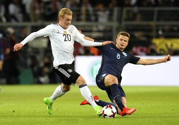Eric Dier of England tackles Julian Brandt of Germany during the International Friendly Länderspiel at Signal Iduna Park, Dortmund. Picture date: March 22nd, 2017. Pic credit should read: Matt McNulty Sportimage EDITORIAL USE ONLY. No use with unauthorised audio, video, data, fixture lists, club league logos or live services. Online in-match use limited to 120 images, no video emulation. No use in betting, games or single club league player publications.