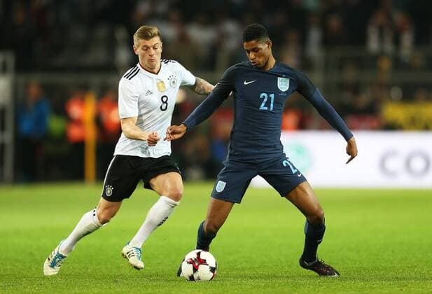 Marcus Rashford of England takes on Toni Kroos of Germany during the International Friendly Länderspiel at Signal Iduna Park, Dortmund. Picture date: March 22nd, 2017. Pic credit should read: Matt McNulty Sportimage EDITORIAL USE ONLY. No use with unauthorised audio, video, data, fixture lists, club league logos or live services. Online in-match use limited to 120 images, no video emulation. No use in betting, games or single club league player publications.
