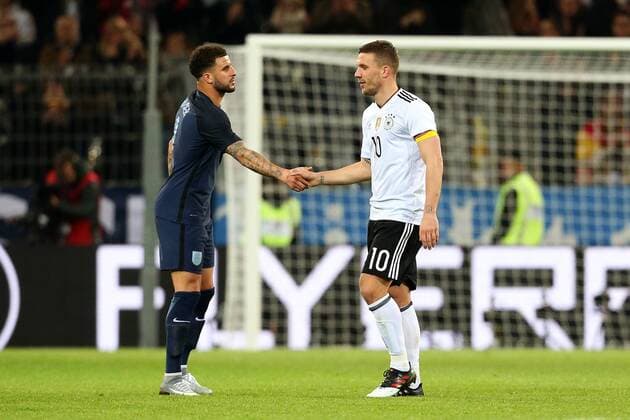 Lukas Podolski of Germany shakes hands with Kyle Walker of England during the International Friendly Länderspiel at Signal Iduna Park, Dortmund. Picture date: March 22nd, 2017. Pic credit should read: Matt McNulty Sportimage EDITORIAL USE ONLY. No use with unauthorised audio, video, data, fixture lists, club league logos or live services. Online in-match use limited to 120 images, no video emulation. No use in betting, games or single club league player publications.
