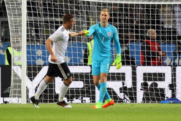 22.03.2017, Signal Iduna Park, Dortmund, GER, Testspiel, Deutschland vs England, im Bild Mutual respect from Joe Hart of England and Lukas Podolski of Germany after he scores his sides 1st goal Mutual respect from Joe Hart of England and Lukas Podolski of Germany after he scores his sides 1st goal during the friendly soccer match between Germany and England at the Signal Iduna Park in Dortmund, Germany on 2017 03 22. Dortmund  EP_fil  