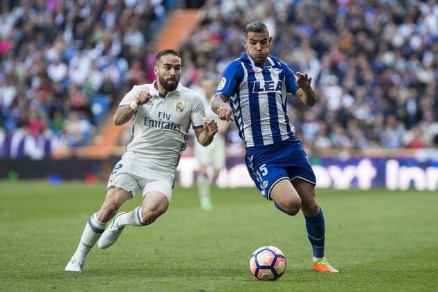 Daniel Carvajal of Real Madrid competes for the ball with Theo Hernandez of Club Deportivo Alaves during the match of La Liga between Real Madrid and Deportivo Alaves at Bernabeu Stadium Stadium in Madrid, Spain. April 02, 2017.  (20170402077)