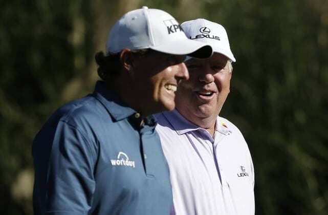 Phil Mickelson and Mark O Meara smile as they walk from the tee box at a practice round on Tuesday at the 2017 Masters Tournament at Augusta National Golf Club in Augusta, Georgia on April 4, 2017.  AUG20170404129 JOHNxANGELILLO