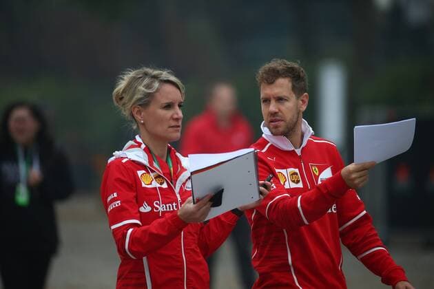 Chinese Grand Prix, Shanghai 06 - 09 April 2017 06.04.2017 - Britta Roeske (AUT) Ferrari Press Officer. and Sebastian Vettel (GER) Scuderia Ferrari SF70H 