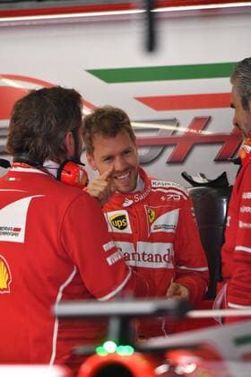 German F1 Sebastian Vettel of Ferrari talks to colleagues during a practice session for the 2017 Formula 1 Chinese Grand Prix at the Shanghai International Circuit in Shanghai, China, 7 April 2017. F1 drivers in full swing for Chinese Grand Prix in practice session  20170407_06419