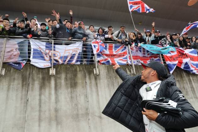 British F1 driver Lewis Hamilton of Mercedes sends hats with his autographs to fans as gifts at the Shanghai International Circuit in Shanghai, China, 7 April 2017. Lewis Hamilton fascinates fans with gifts in Shanghai  20170407_31255
