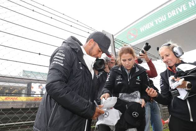 British F1 driver Lewis Hamilton of Mercedes signs autographs for fans at the Shanghai International Circuit in Shanghai, China, 7 April 2017. Lewis Hamilton fascinates fans with gifts in Shanghai  20170407_82617