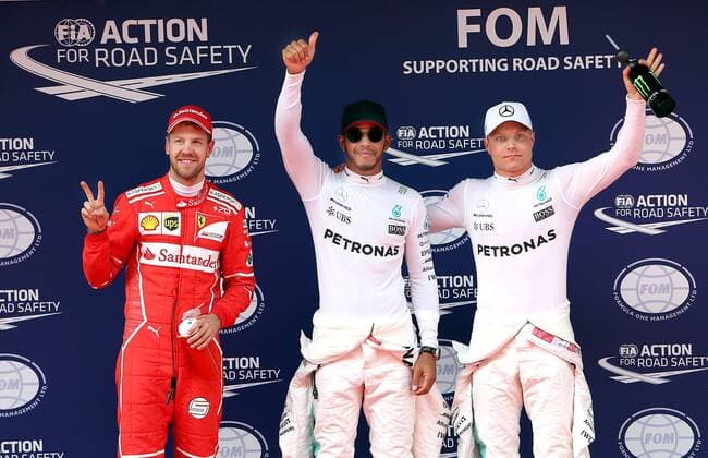 (170408) -- SHANGHAI, April 8, 2017 -- Mercedes driver Lewis Hamilton (C) of Britain, Valtteri Bottas (R) of Finland and Ferrari s Sebastian Vettel of Germany celebrate on the podium after the qualifying session for the Formula One Chinese Grand Prix at the Shanghai International Circuit in Shanghai, east China, April 8, 2017. Lewis Hamilton won the pole position in 1 minute and 31.678 seconds. ) (SP)CHINA-SHANGHAI-F1-2017 CHINESE GRAND PRIX-QUALIFYING (CN) FanxJun 