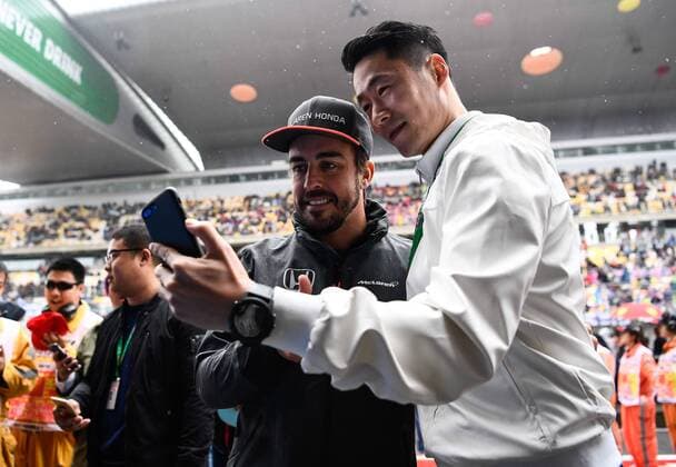 Spanish F1 driver Fernando Alonso of McLaren, left, takes selfies with retired Chinese Table tennis Tischtennis player Wang Liqin ahead of the 2017 Formula One Chinese Grand Prix at the Shanghai International Circuit in Shanghai, China, 9 April 2017. F1 drivers shows off table tennis skills in Shanghai  pbu604570_09