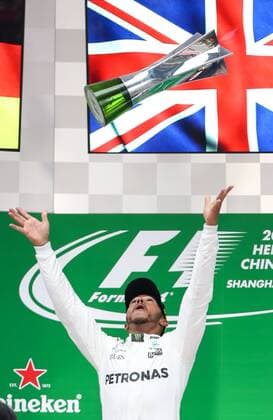 British F1 driver Lewis Hamilton of Mercedes tosses his trophy into the air on the podium during the award presentation ceremony after winning the Formula One Chinese Grand Prix at the Shanghai International Circuit in Shanghai, China, 9 April 2017. Lewis Hamilton wins 2017 Formula 1 Chinese Grand Prix  pbu604643_18