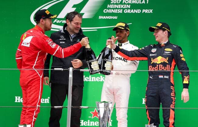 German F1 Sebastian Vettel of Ferrari, left, British F1 driver Lewis Hamilton of Mercedes, second right, and Dutch F1 driver Max Verstappen of Red Bull Racing, right, drink champagne during the award presentation ceremony of the 2017 Formula One Chinese Grand Prix at the Shanghai International Circuit in Shanghai, China, 9 April 2017. Lewis Hamilton wins 2017 Formula 1 Chinese Grand Prix  pbu604643_26