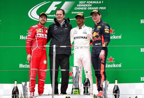 German F1 Sebastian Vettel of Ferrari, left, British F1 driver Lewis Hamilton of Mercedes, second right, and Dutch F1 driver Max Verstappen of Red Bull Racing, right, pose during the award presentation ceremony of the 2017 Formula One Chinese Grand Prix at the Shanghai International Circuit in Shanghai, China, 9 April 2017. Lewis Hamilton wins 2017 Formula 1 Chinese Grand Prix  pbu604643_28