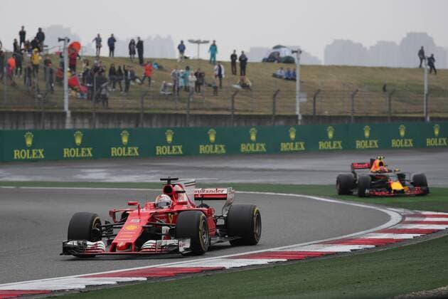 Chinese Grand Prix, Shanghai 06 - 09 April 2017 09.04.2017 - Race, Sebastian Vettel (GER) Scuderia Ferrari SF70H overtakes Max Verstappen (NED) Red Bull Racing RB13 