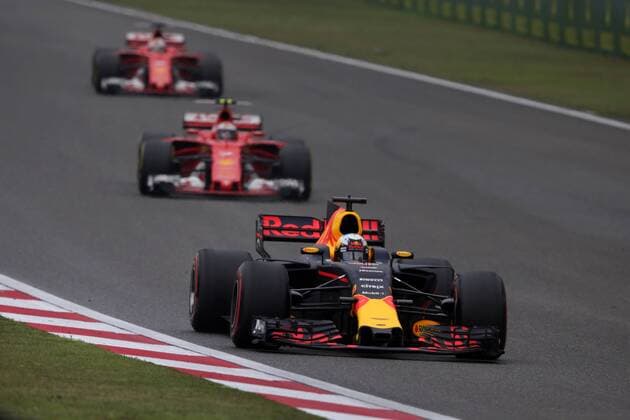 Chinese Grand Prix, Shanghai 06 - 09 April 2017 09.04.2017 - Race, Daniel Ricciardo (AUS) Red Bull Racing RB13 leads Kimi Raikkonen (FIN) Scuderia Ferrari SF70H and Sebastian Vettel (GER) Scuderia Ferrari SF70H 