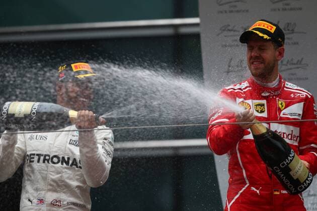 Chinese Grand Prix, Shanghai 06 - 09 April 2017 09.04.2017 - Race, Lewis Hamilton (GBR) Mercedes AMG F1 W08 race winner and 2nd place Sebastian Vettel (GER) Scuderia Ferrari SF70H 