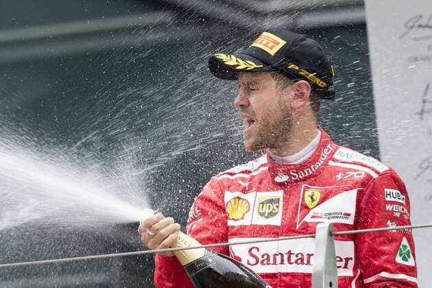 German F1 Sebastian Vettel of Ferrari sprays champagne to celebrate during the award presentation ceremony after winning the first runner-up of the 2017 Formula 1 Chinese Grand Prix at the Shanghai International Circuit in Shanghai, China, 9 April 2017. Lewis Hamilton wins Formula 1 Chinese Grand Prix  20170409_62991