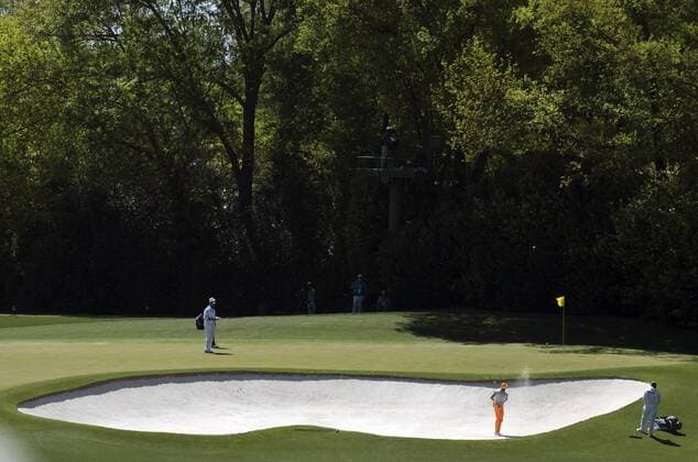 Ricky Fowler hits from a bunker on the 4th hole during the fourth round of the 2017 Masters Tournament at Augusta National Golf Club in Augusta, Georgia on April 9, 2017.  AUG20170409310 KEVINxDIETSCH