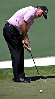 April 9, 2017 - Augusta, GA, USA - Phil Mickelson sinks a putt on the second green during the final round of the Masters Tournament on Sunday, April 9, 2017 at Augusta National Golf Club in Augusta, Ga. 2017 Masters Round 4 - ZUMAm67_ 20170409_zaf_m67_051 Copyright: xJeffxSinerx