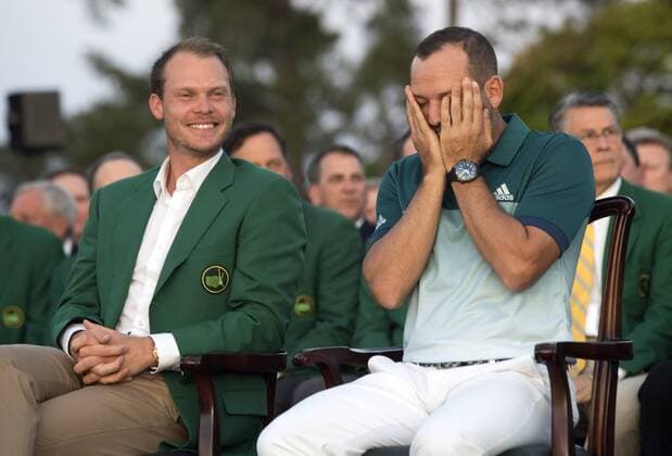Sergio Garcia (R) covers his face after winning the 2017 Masters Tournament as he sits next to 2016 champion 2016 Masters Champion Danny Willett, at Augusta National Golf Club in Augusta, Georgia on April 9, 2017. Garcia beat out Justin Rose by one stoke in a one hole playoff. This is Garcia s first major win.  AUG20170409332 KEVINxDIETSCH