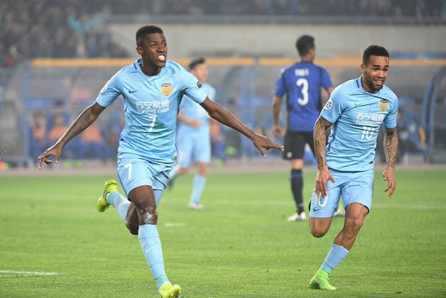 Brazilian football players Alex Teixeira of China s Jiangsu Suning, right, and Ramires of China s Jiangsu Suning celebrate after scoring a goal against Japan s Gamba Osaka in their Group H match during the AFC Champions League 2017 in Nanjing city, east China s Jiangsu province, 11 April 2017. Jiangsu Suning competes against Gamba Osaka at AFC Champions League group match  20170411_81207