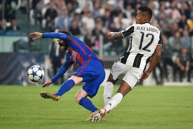 April 11, 2017 - Rome, Italy - Lionel Messi of FC Barcelona Barca is challenged by Alex Sandro of Juventus during the UEFA Champions League quarter final match between Juventus and Barcelona at the Juventus Stadium, Turin, Italy on 11 April 2017. Juventus - Barcelona Champions League  - ZUMAn230 20170411_zaa_n230_064 Copyright: xGiuseppexMaffiax