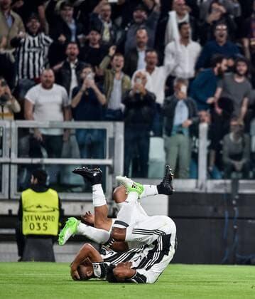 Paulo Dybala of Juventus and Juan Cuadrado of Juventus celebrates the goal during the UEFA Champions League quarter final match between Juventus and Barcelona at the Juventus Stadium, Turin, Italy on 11 April 2017. Copyright: xGiuseppexMaffiax 14920068