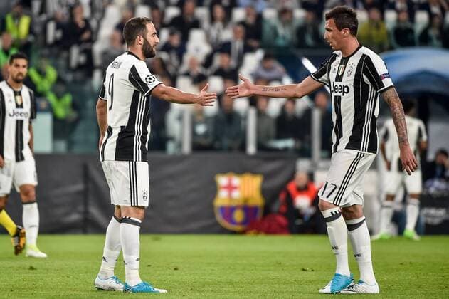 Gonzalo Higuain of Juventus and Mario Mandzukic of Juventus during the UEFA Champions League quarter final match between Juventus and Barcelona at the Juventus Stadium, Turin, Italy on 11 April 2017. Copyright: xGiuseppexMaffiax 14920083