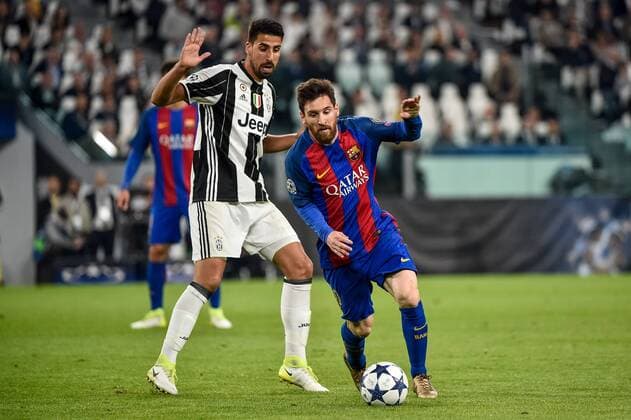 Lionel Messi of Barcelona and Sami Khedira of Juventus during the UEFA Champions League quarter final match between Juventus and Barcelona at the Juventus Stadium, Turin, Italy on 11 April 2017. Copyright: xGiuseppexMaffiax 14920102