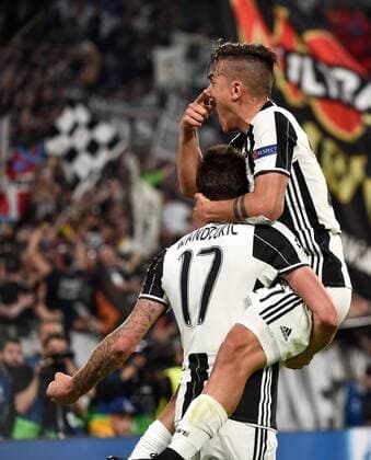 April 11, 2017 - Rome, Italy - Paulo Dybala of Juventus celebrates scoring second goal during the UEFA Champions League quarter final match between Juventus and Barcelona at the Juventus Stadium, Turin. Soccer 2017 - Juventus 3-0 Barcelona  - ZUMAn230 20170411_zaa_n230_074 Copyright: xGiuseppexMaffiax
